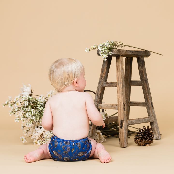 Little baby wearing Onesize Reusable Pocket Nappy with Hedgehog illustrations by LittleLamb#color_truffle-shuffle