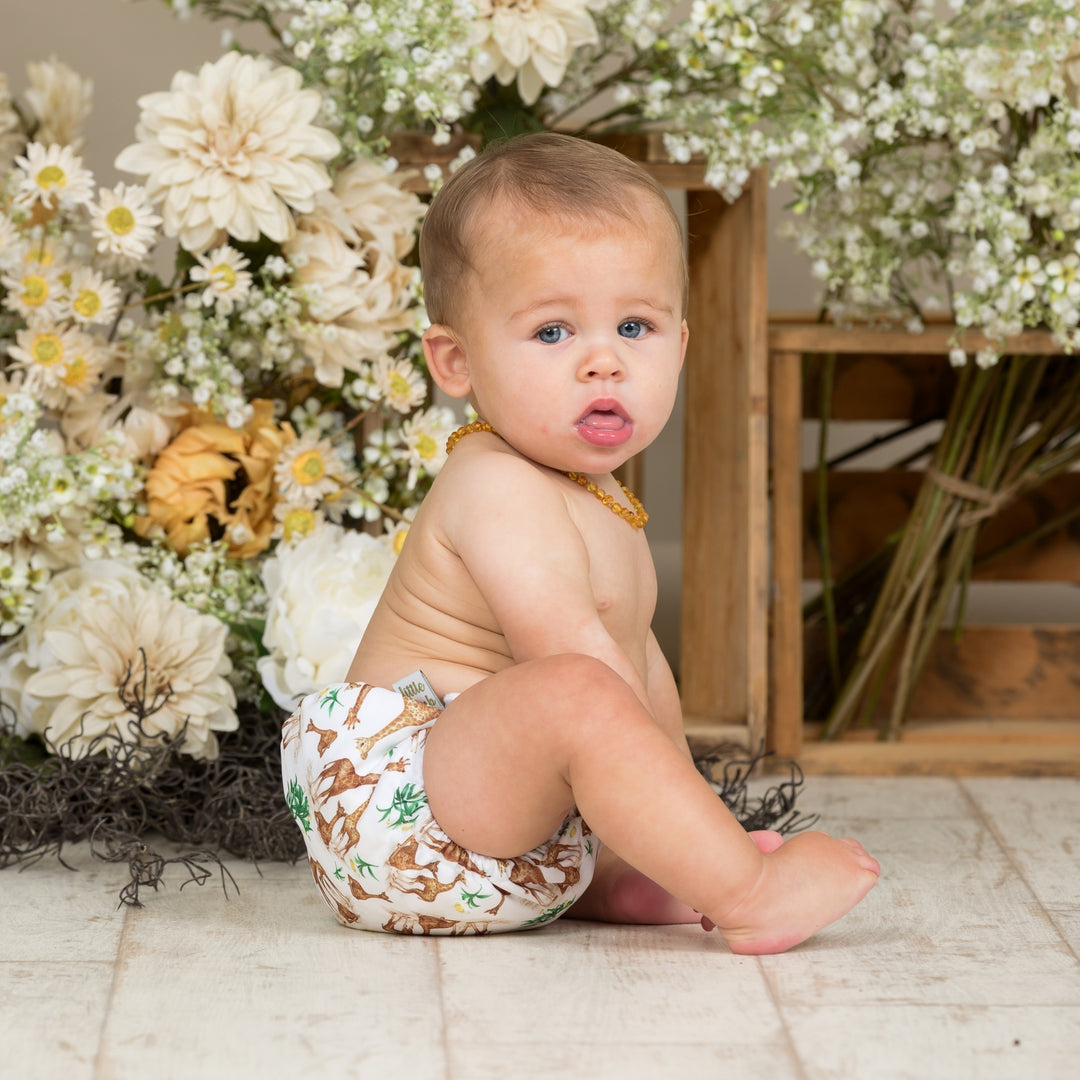 Baby sitting, wearing Onesize Reusable Pocket Nappy with Giraffe illustrations by LittleLamb#color_head-in-the-clouds