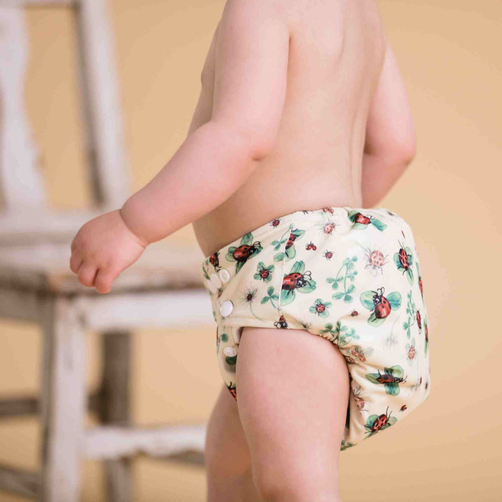 Baby Wearing Onesize Reusable Pocket Nappy in insect print by LittleLamb